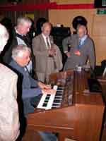 Laurie playing organ. Neil, Alan and Ken Draper