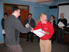 Laurie presenting 2012 students with course certificate