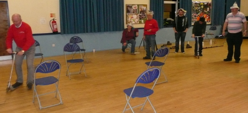 Pete scooting round the chairs