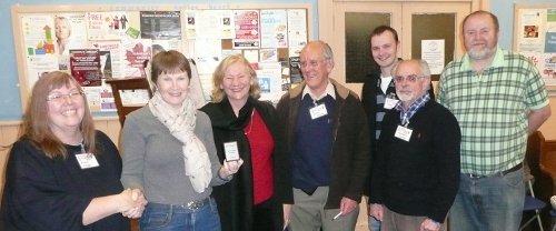 Karen presents the mini shield to Anne and her team - Maggie, Brian, Andy, Jonathan and Chas