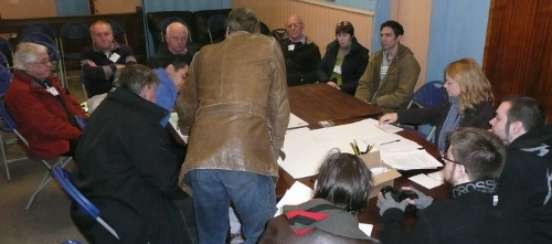 Steve (standing) discussing detailks of the script