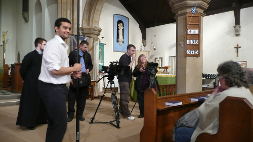 Leon (the verger), Eric, Krzystof, Dave and Karen filming Mary and others in the pews