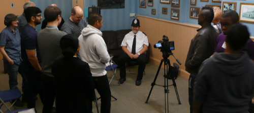 Chas ready for interview watched by students and members