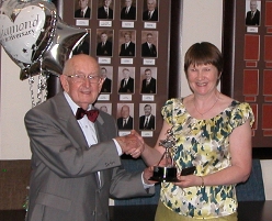 Anne receives the Stan Olman trophy, the last of her three trophies