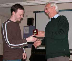 Andy receiving the award from Geoff