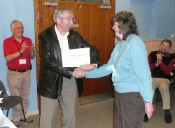 Jill presenting Phil with certificate
