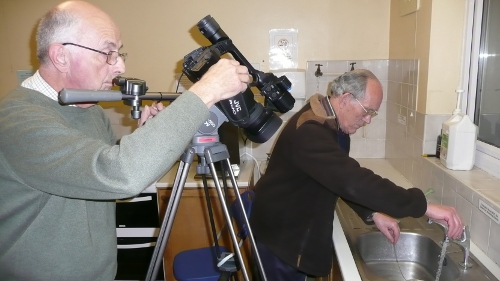 David and Brian preparing to film water going down a plug-hole