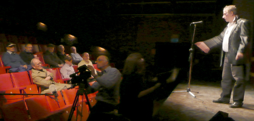 Lawrence directing his group in the auditorium