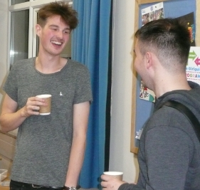 Gully talking to Tom in tea break