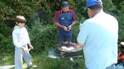 Carlos jnr with Carlos & Jorge cooking